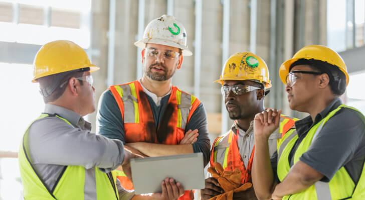 Group of professionals wearing hard hats